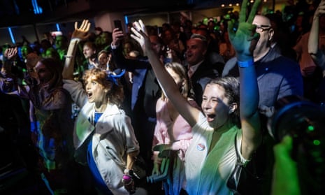 Progressive Slovakia supporters react to the first exit polls at the party’s headquarters.